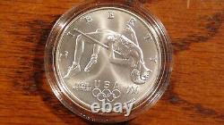 1996 D Atlanta Olympics Track & Field 1 Oz. 999 Silver Coin In Hard Capsule